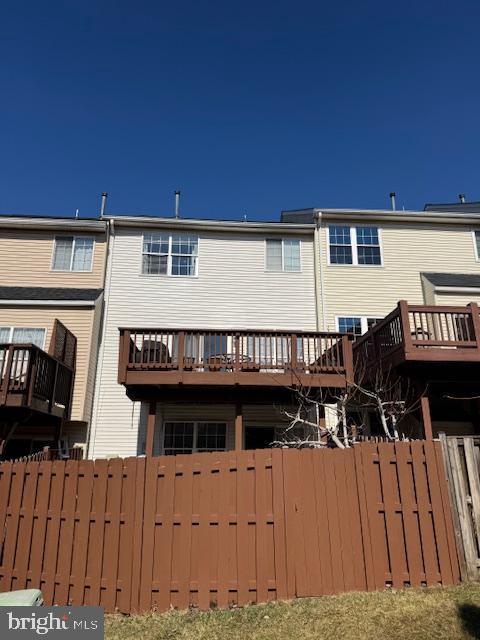 6357 Regal Oak Drive Springfield, VA 22152 - Photo 42 of 42 a view of a house with wooden deck