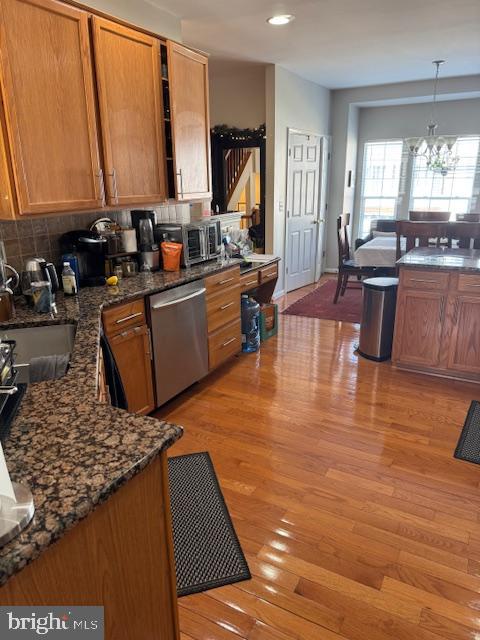 6357 Regal Oak Drive Springfield, VA 22152 - Photo 5 of 42 a kitchen with stainless steel appliances granite countertop a stove a sink and a refrigerator