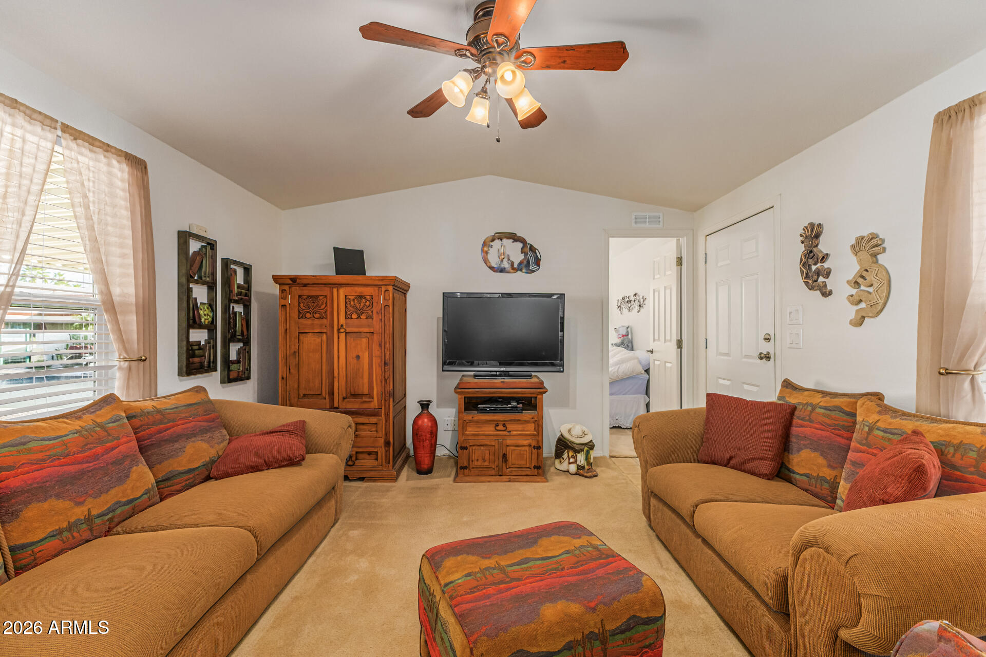 9302 East Broadway Road, Unit 186 Mesa, AZ 85208 - Photo 14 of 40 a living room with furniture and a flat screen tv