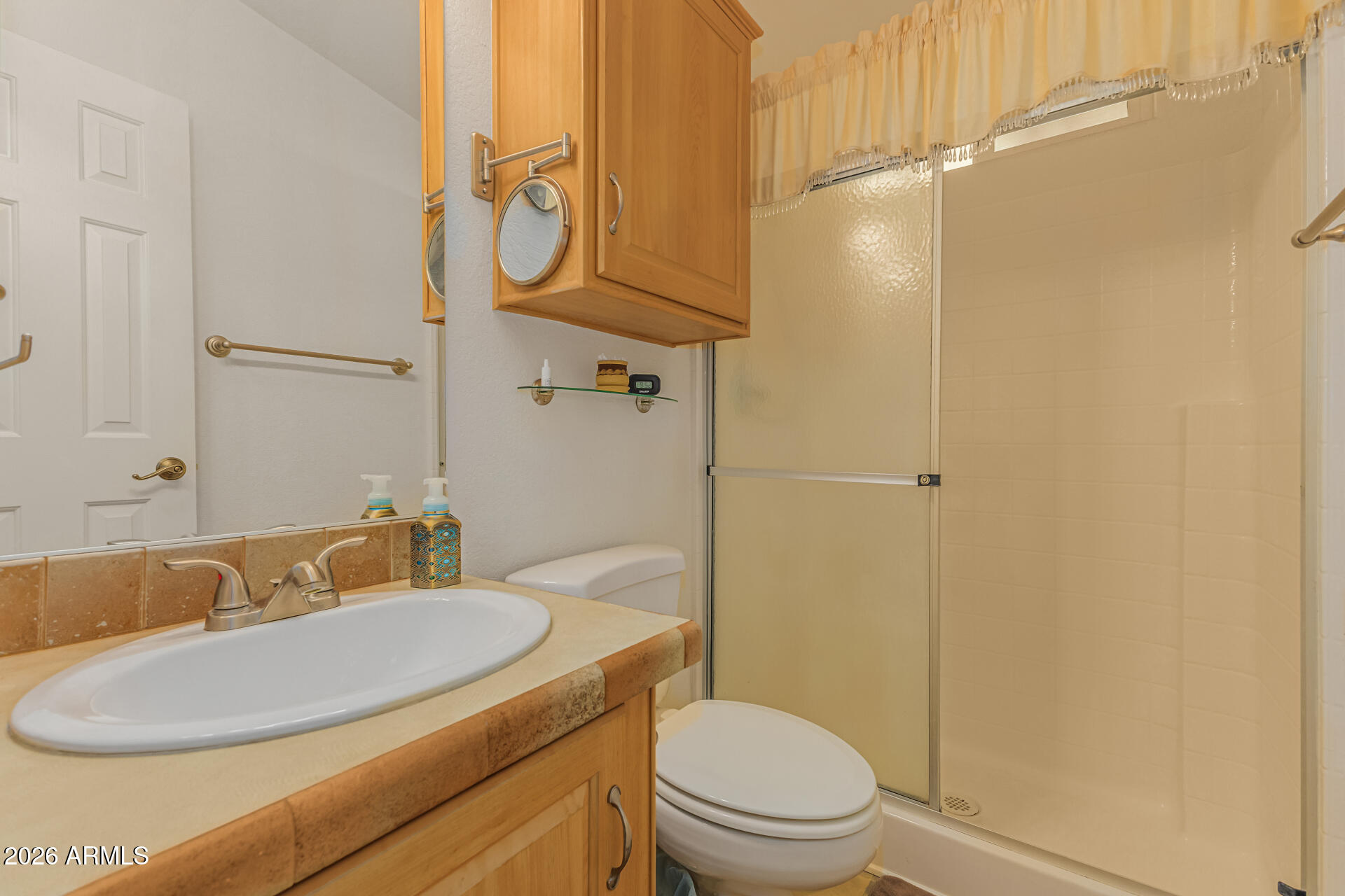 9302 East Broadway Road, Unit 186 Mesa, AZ 85208 - Photo 22 of 40 a bathroom with a granite countertop sink toilet and shower