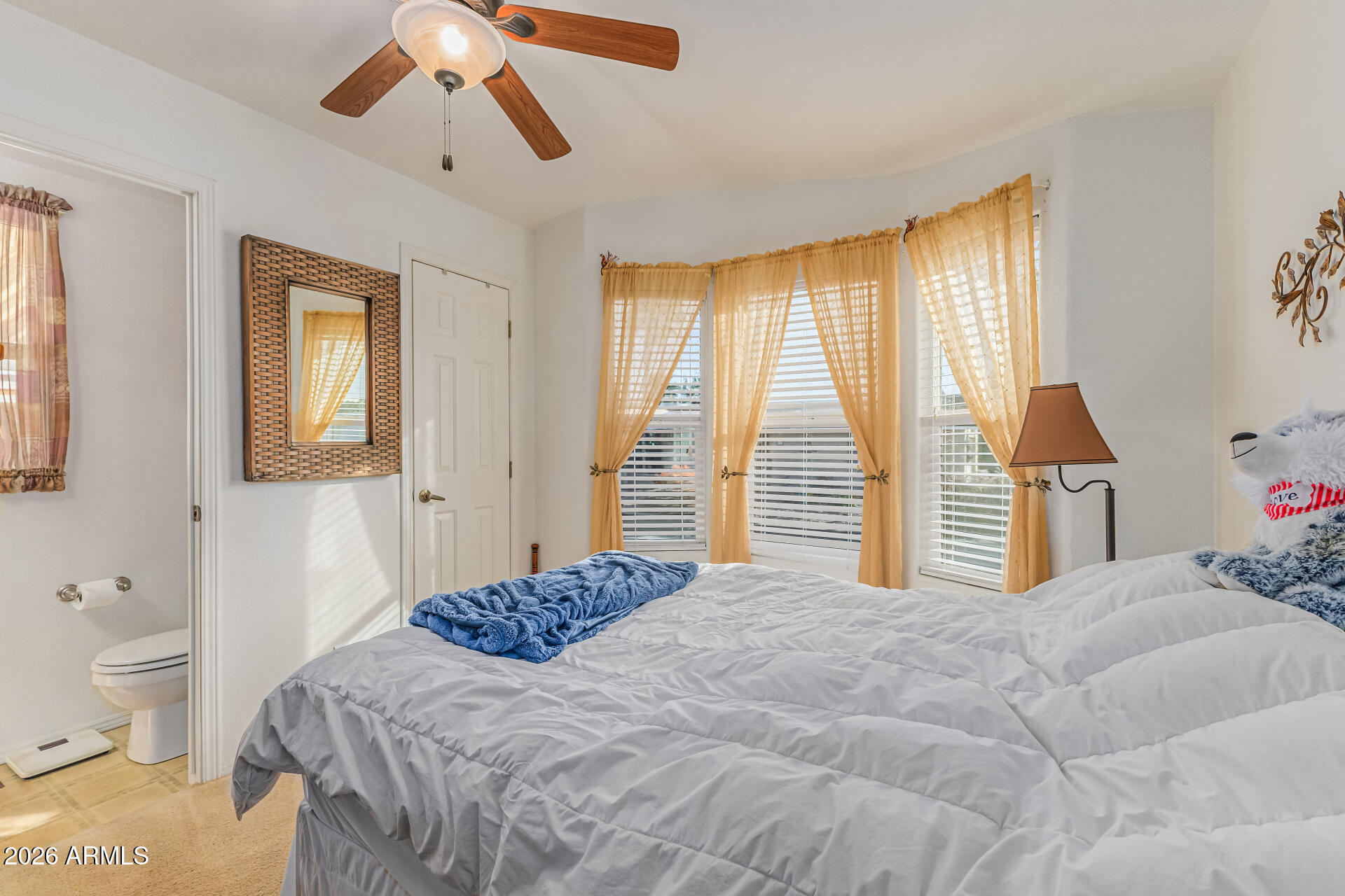 9302 East Broadway Road, Unit 186 Mesa, AZ 85208 - Photo 23 of 40 a bedroom with a bed and wooden floor