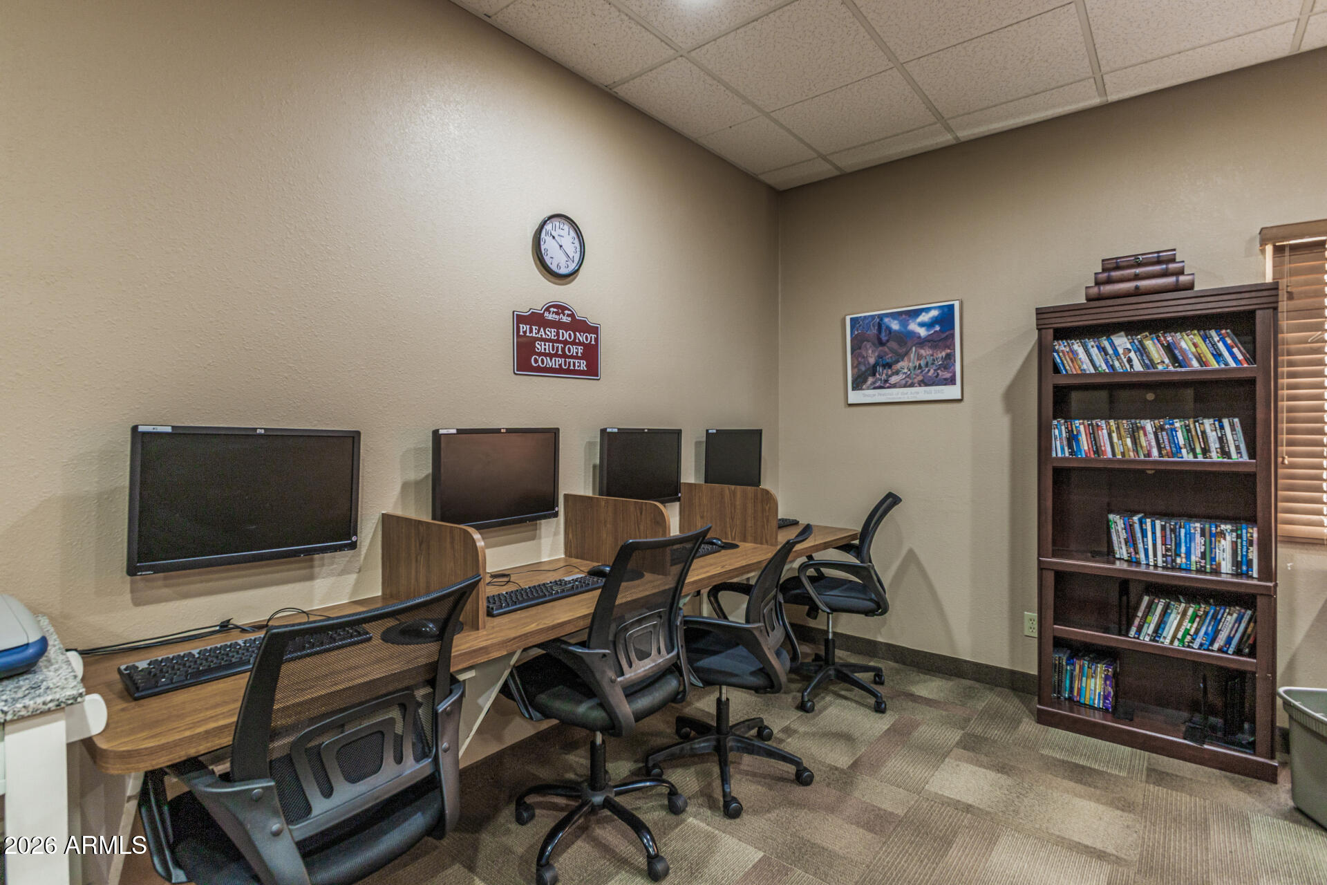 9302 East Broadway Road, Unit 186 Mesa, AZ 85208 - Photo 37 of 40 a view of a livingroom with furniture and a flat screen tv
