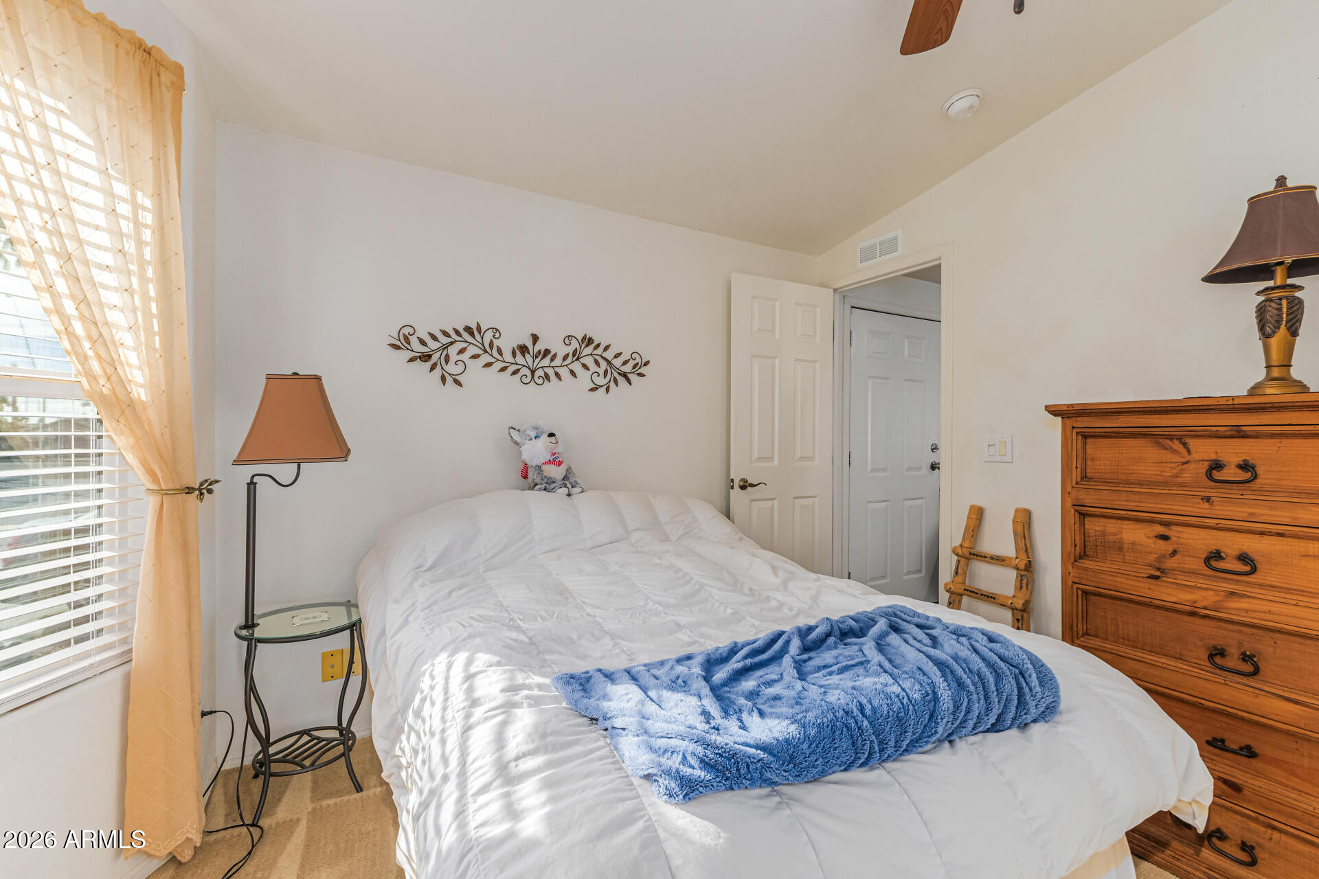 9302 East Broadway Road, Unit 186 Mesa, AZ 85208 - Photo 5 of 40 a bedroom with a bed and a closet