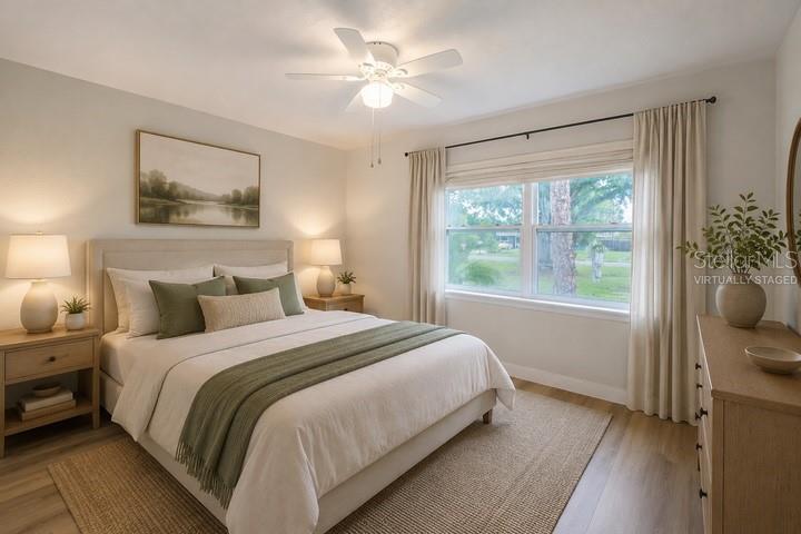 314 4th Avenue Southwest Ruskin, FL 33570 - Photo 3 of 30 a bedroom with a large bed and a window