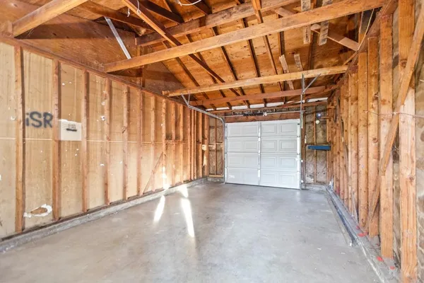 a view of a room with wooden walls