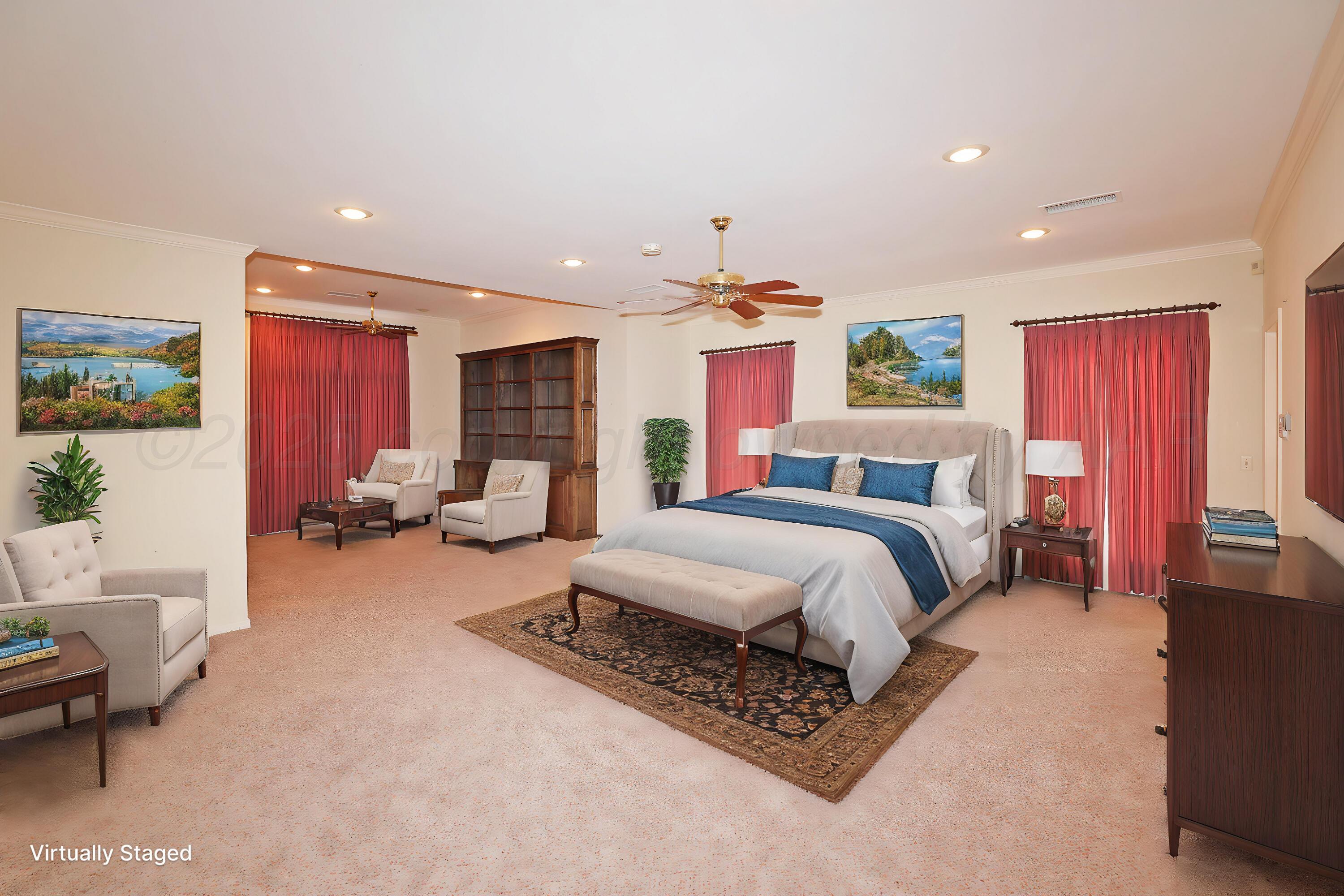 7707 Bent Tree Drive Amarillo, TX 79121 - Photo 19 of 47 a spacious bedroom with a bed couch and a window