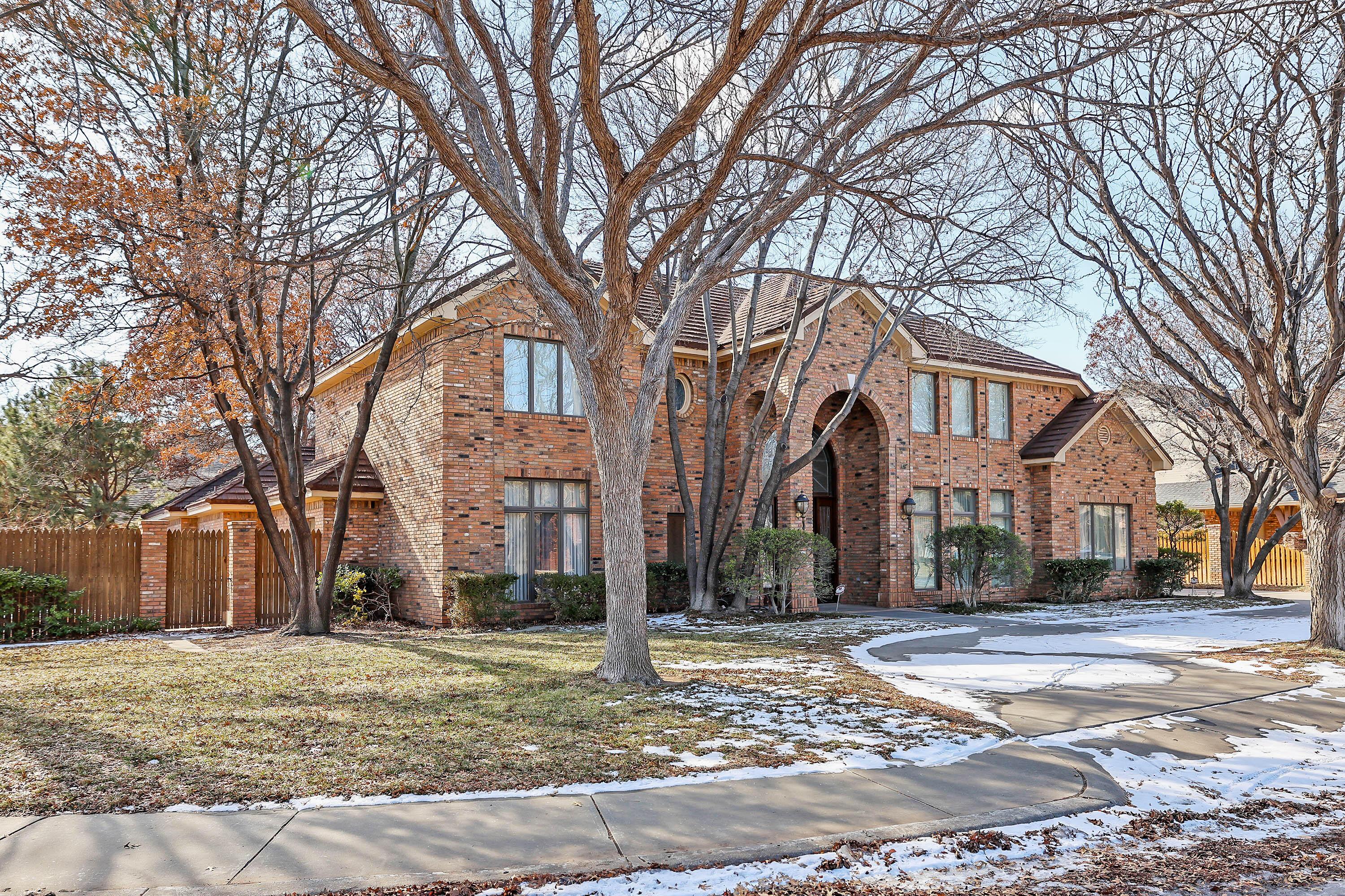 7707 Bent Tree Drive Amarillo, TX 79121 - Photo 2 of 47 a front view of residential houses with yard and trees
