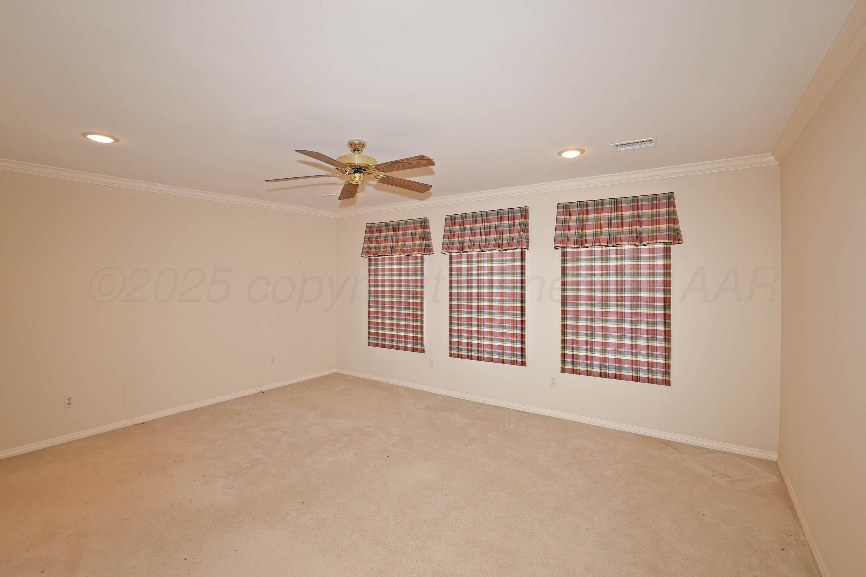 7707 Bent Tree Drive Amarillo, TX 79121 - Photo 26 of 47 a view of an empty room with a window
