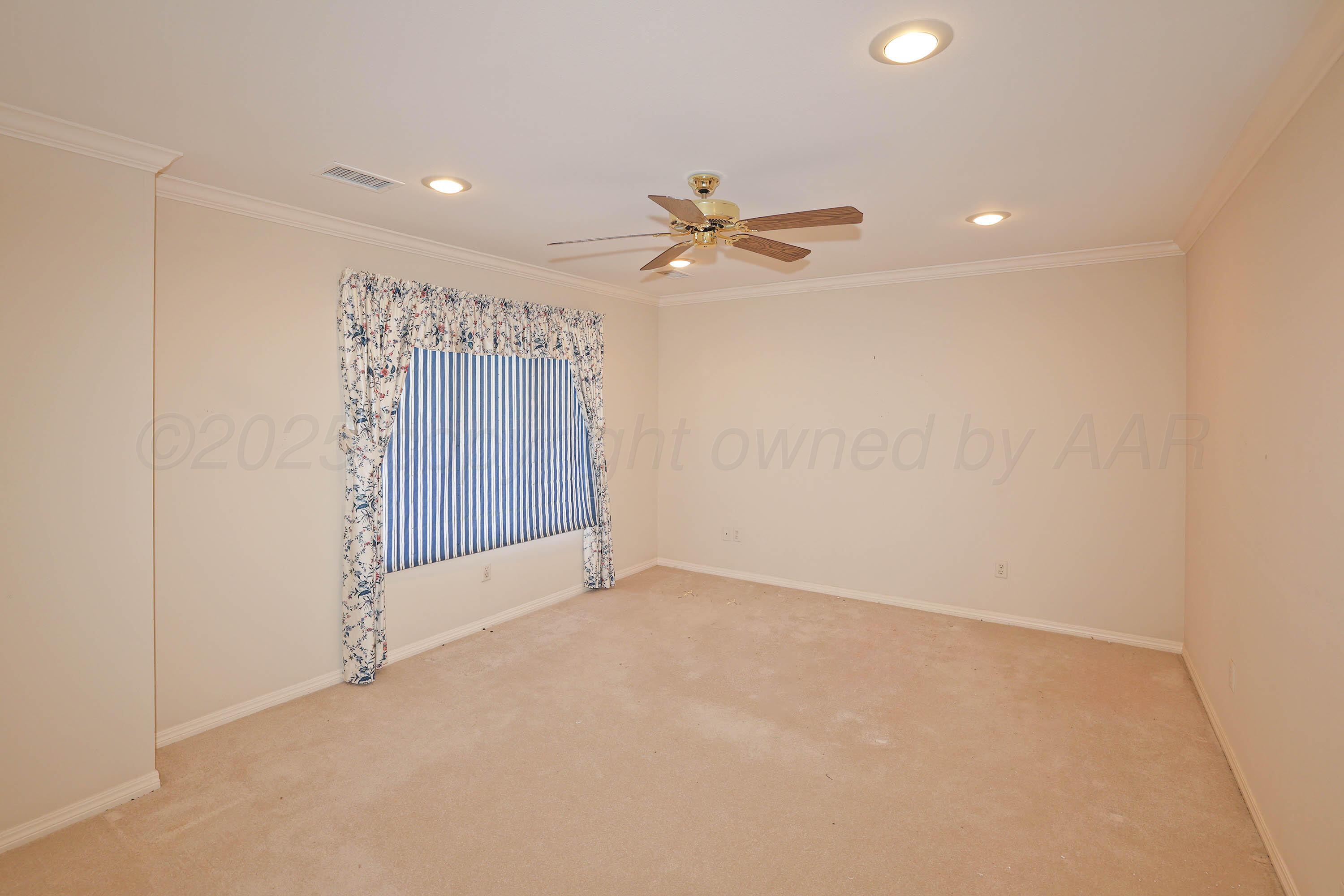 7707 Bent Tree Drive Amarillo, TX 79121 - Photo 30 of 47 wooden floor in an empty room with a window