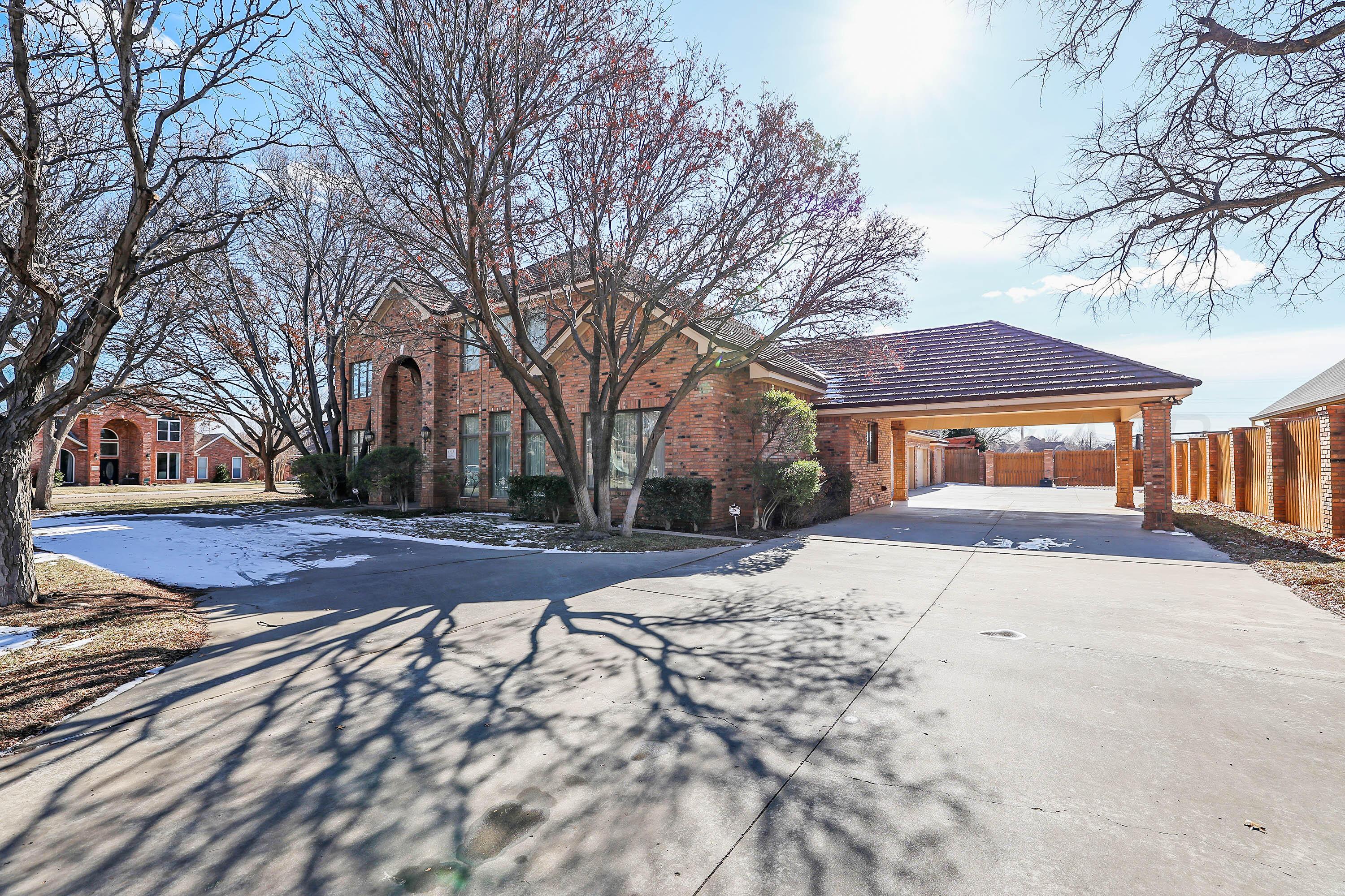 7707 Bent Tree Drive Amarillo, TX 79121 - Photo 3 of 47 a front view of house with yard covered in snow