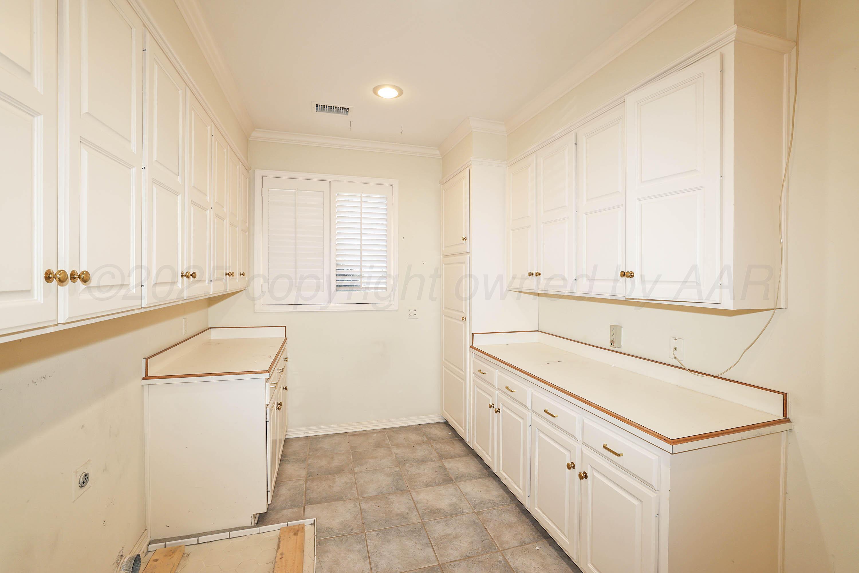 7707 Bent Tree Drive Amarillo, TX 79121 - Photo 39 of 47 a room with storage and utility