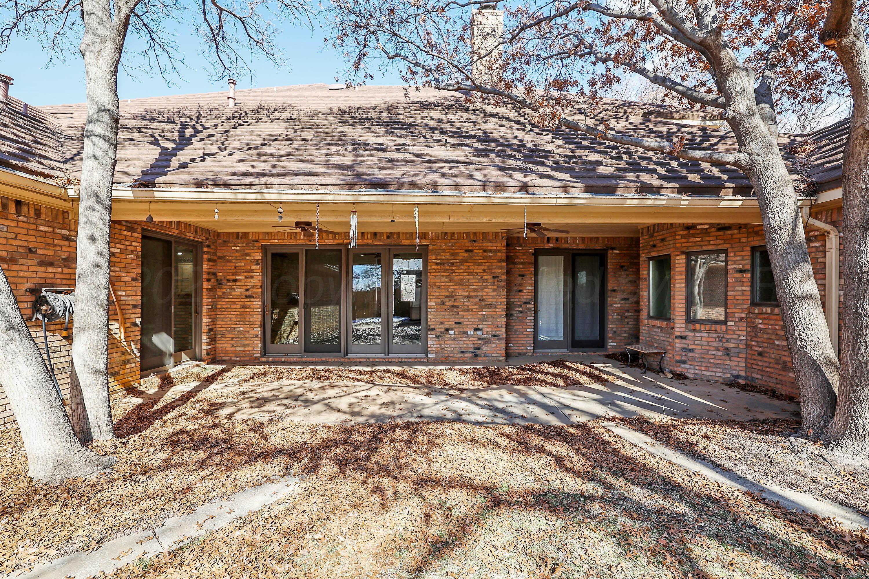 7707 Bent Tree Drive Amarillo, TX 79121 - Photo 43 of 47 a view of a house with a large tree