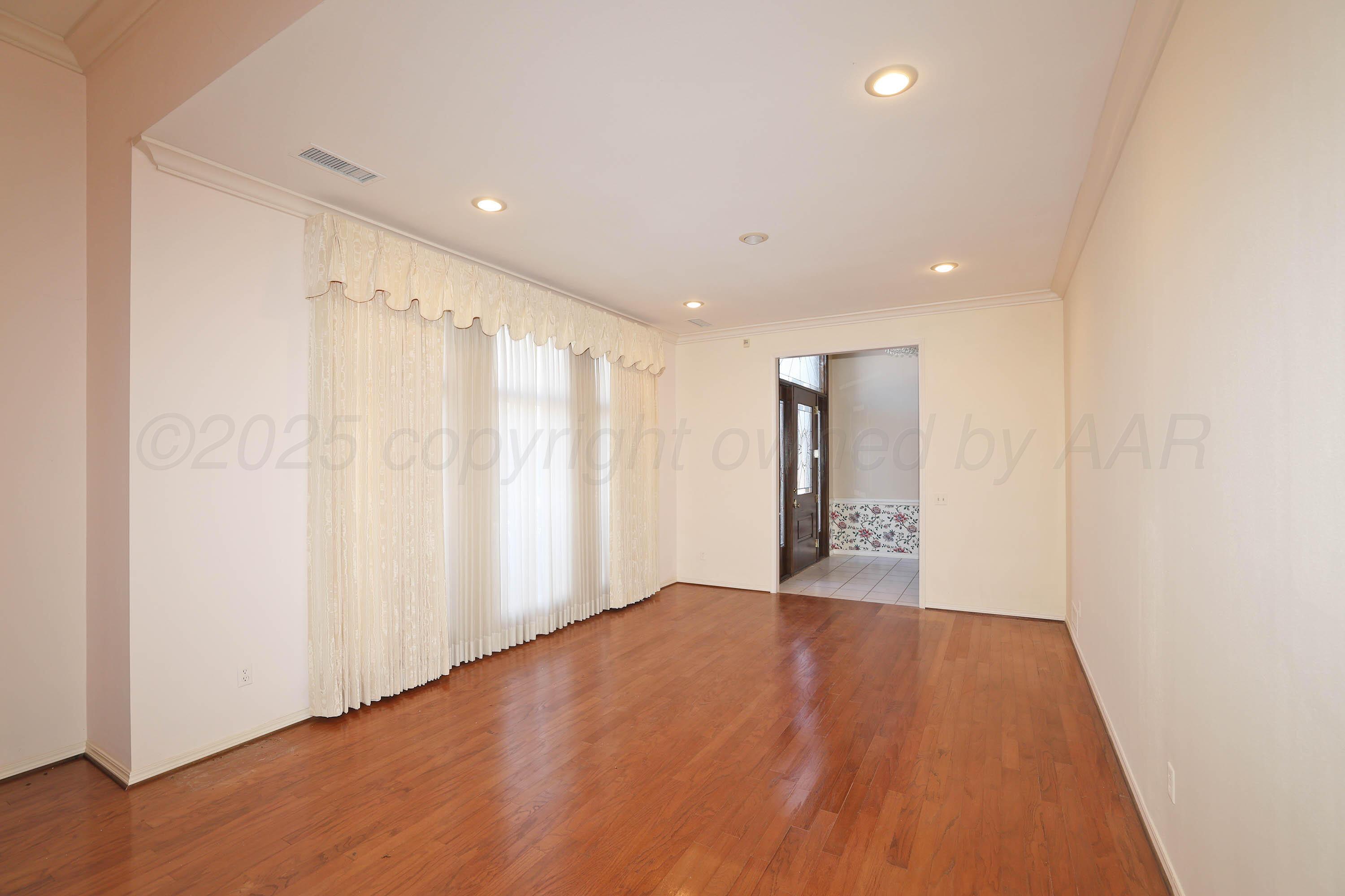 7707 Bent Tree Drive Amarillo, TX 79121 - Photo 7 of 47 a view of an empty room