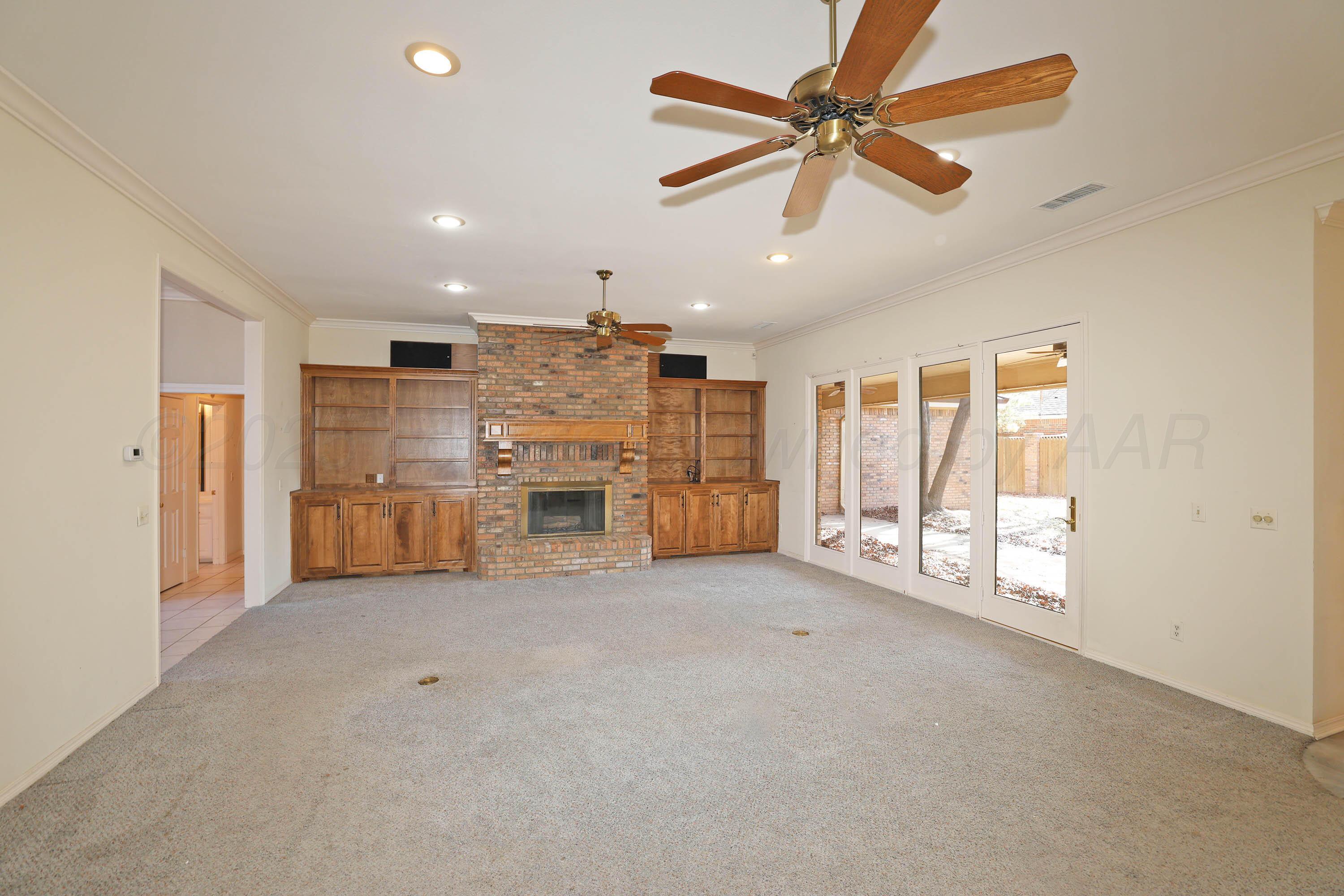 7707 Bent Tree Drive Amarillo, TX 79121 - Photo 8 of 47 a view of an empty room with a kitchen