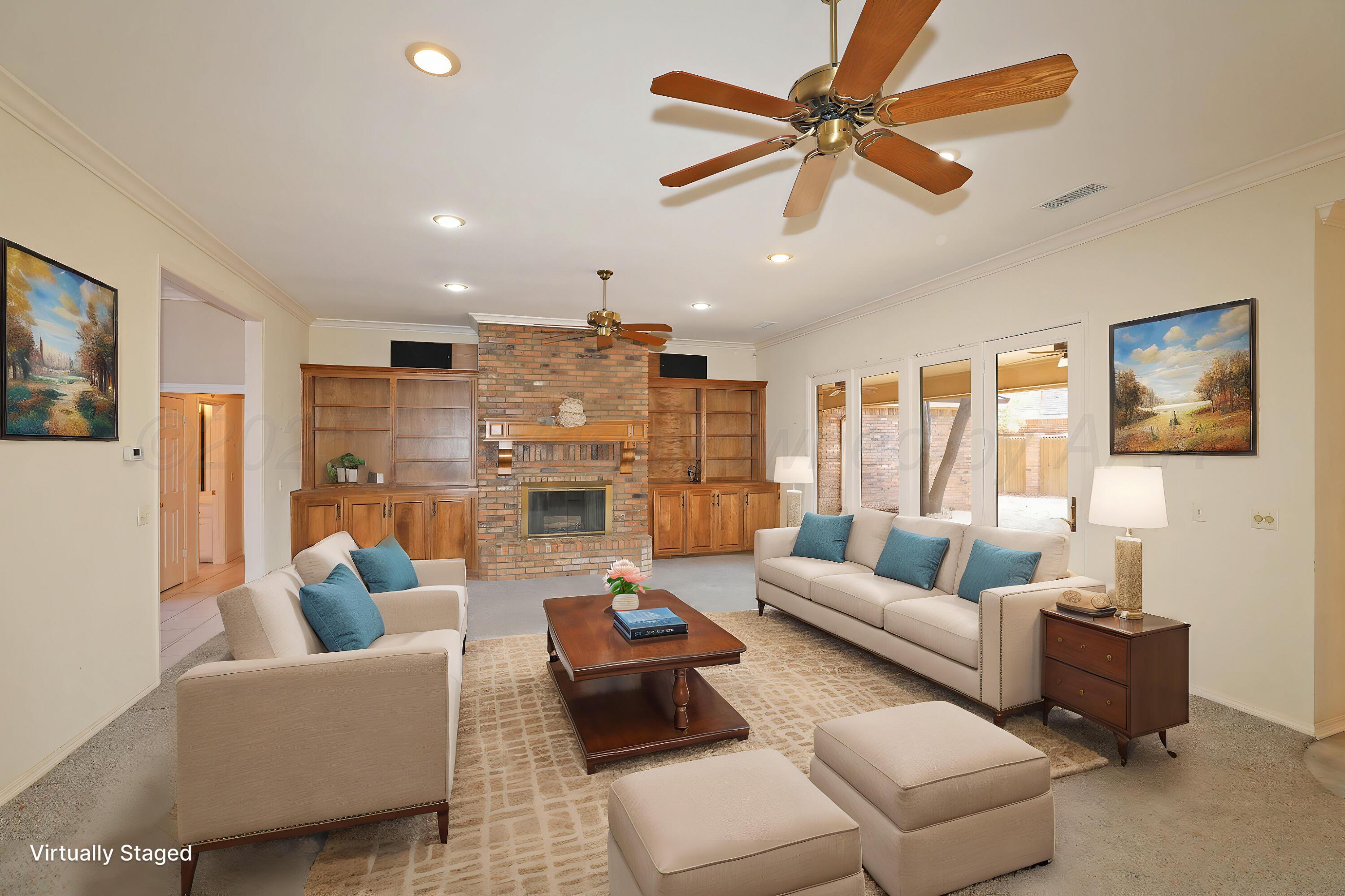 7707 Bent Tree Drive Amarillo, TX 79121 - Photo 9 of 47 a living room with furniture ceiling fan and a rug