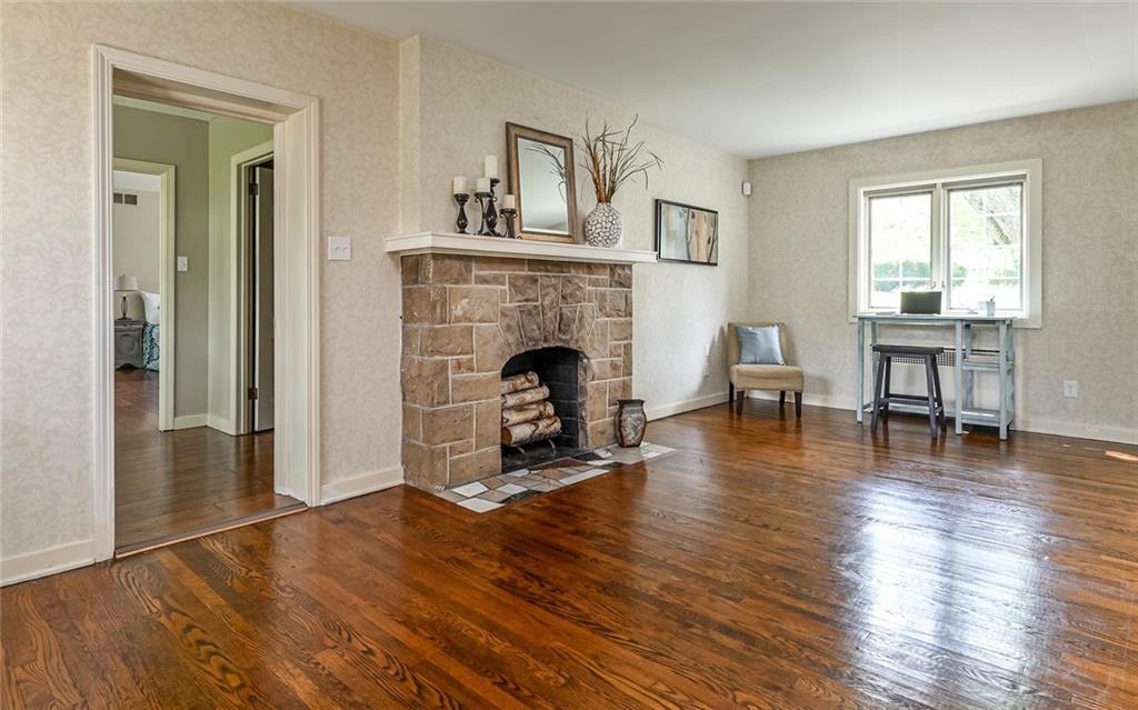 1505 West Ingomar Road Pittsburgh, PA 15237 - Photo 25 of 42 Stone fireplace in and hardwood floors in the bright living room.