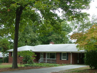 1008 Hammond Road Aiken, SC 29803 - Photo 1 of 1 a view of a white house with a tree and plants