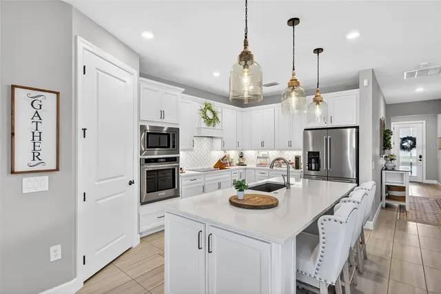 a living room with furniture a rug and a flat screen tv