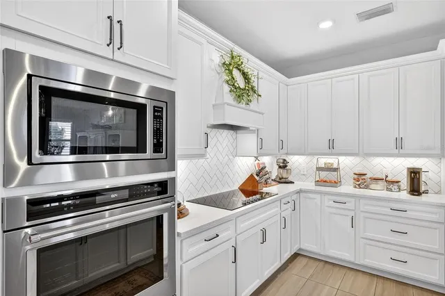 a swimming pool with outdoor seating and a shower