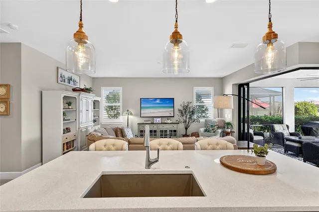 a view of a backyard with table and chairs under an umbrella