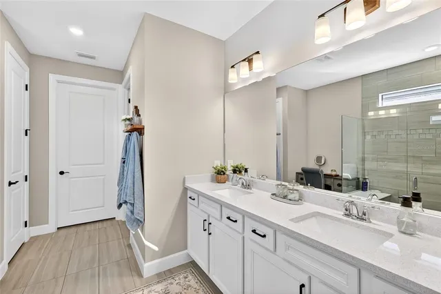 a view of a livingroom with furniture and a floor to ceiling window