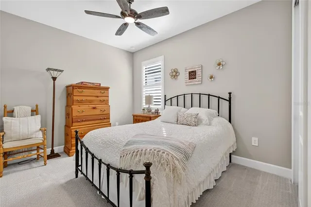 a living room with furniture and a view of kitchen