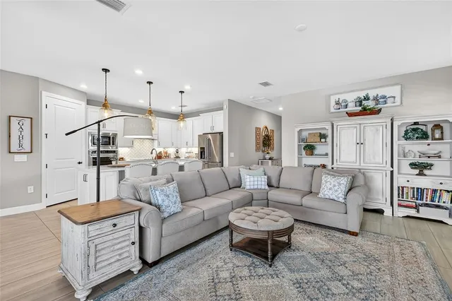 a kitchen with kitchen island a sink stove and chairs