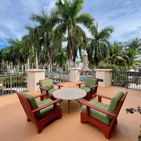 a swimming pool with outdoor seating