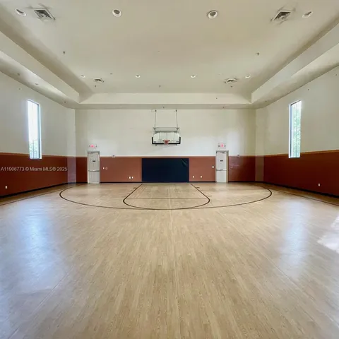 a living room with a couch and a wooden floor