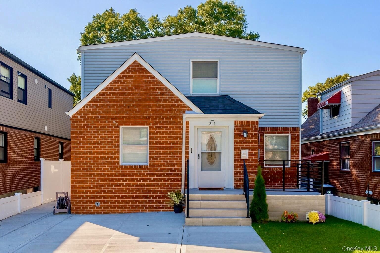 a view of house with yard