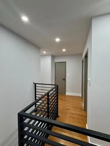 a bathroom with a granite countertop toilet sink and mirror