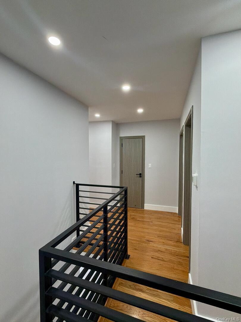 113-40 198th Street Queens, NY 11412 - Photo 11 of 20 a view of staircase with wooden floor
