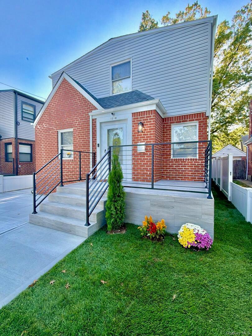 113-40 198th Street Queens, NY 11412 - Photo 2 of 20 a front view of a house with garden