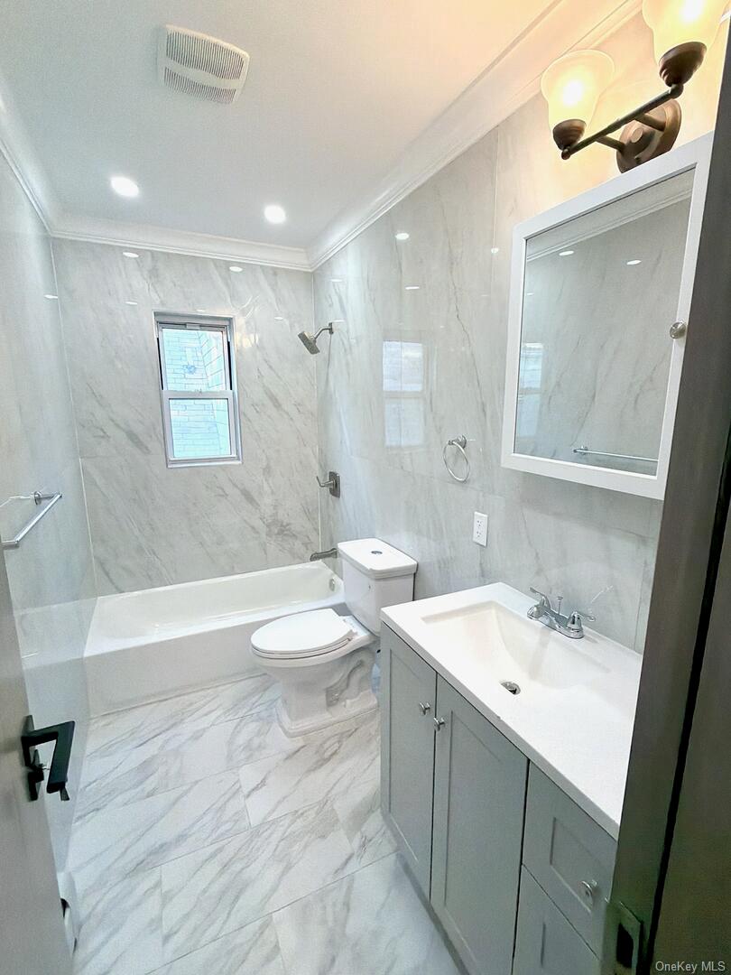 113-40 198th Street Queens, NY 11412 - Photo 10 of 20 a bathroom with a sink a toilet and a bathtub