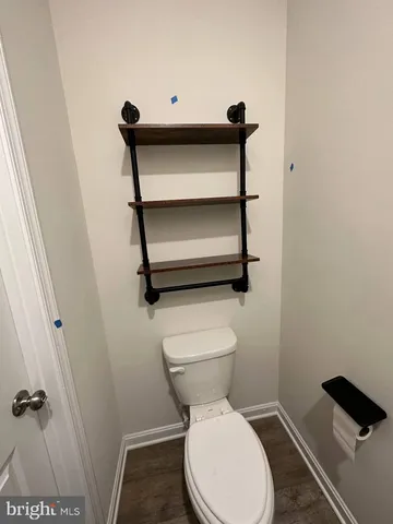a bathroom with a toilet and a vanity