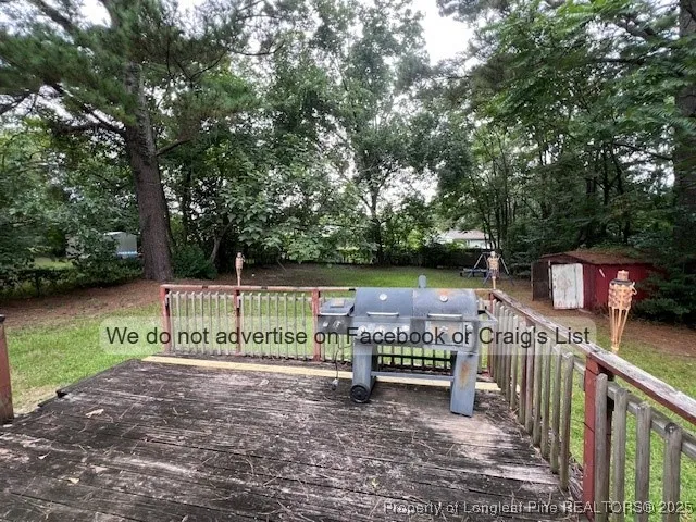 a view of park with a bench and trees