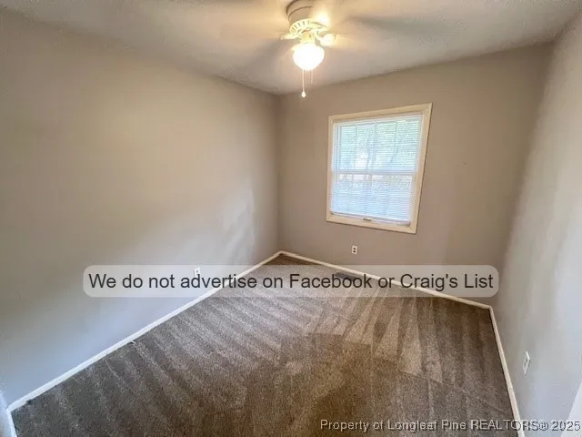 a view of a room with window and wooden floor
