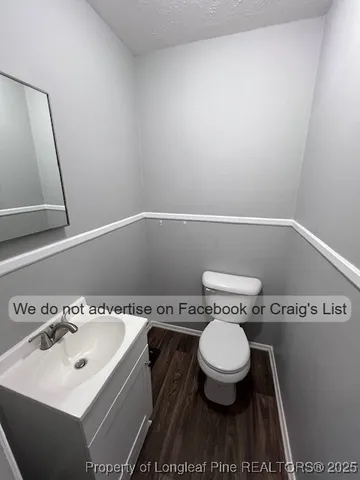 a bathroom with a toilet and a sink