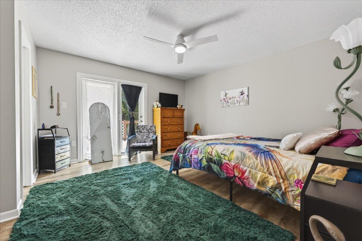 210 Shell Drive Crestview, FL 32536 - Photo 27 of 67 a bedroom with bed and a large mirror