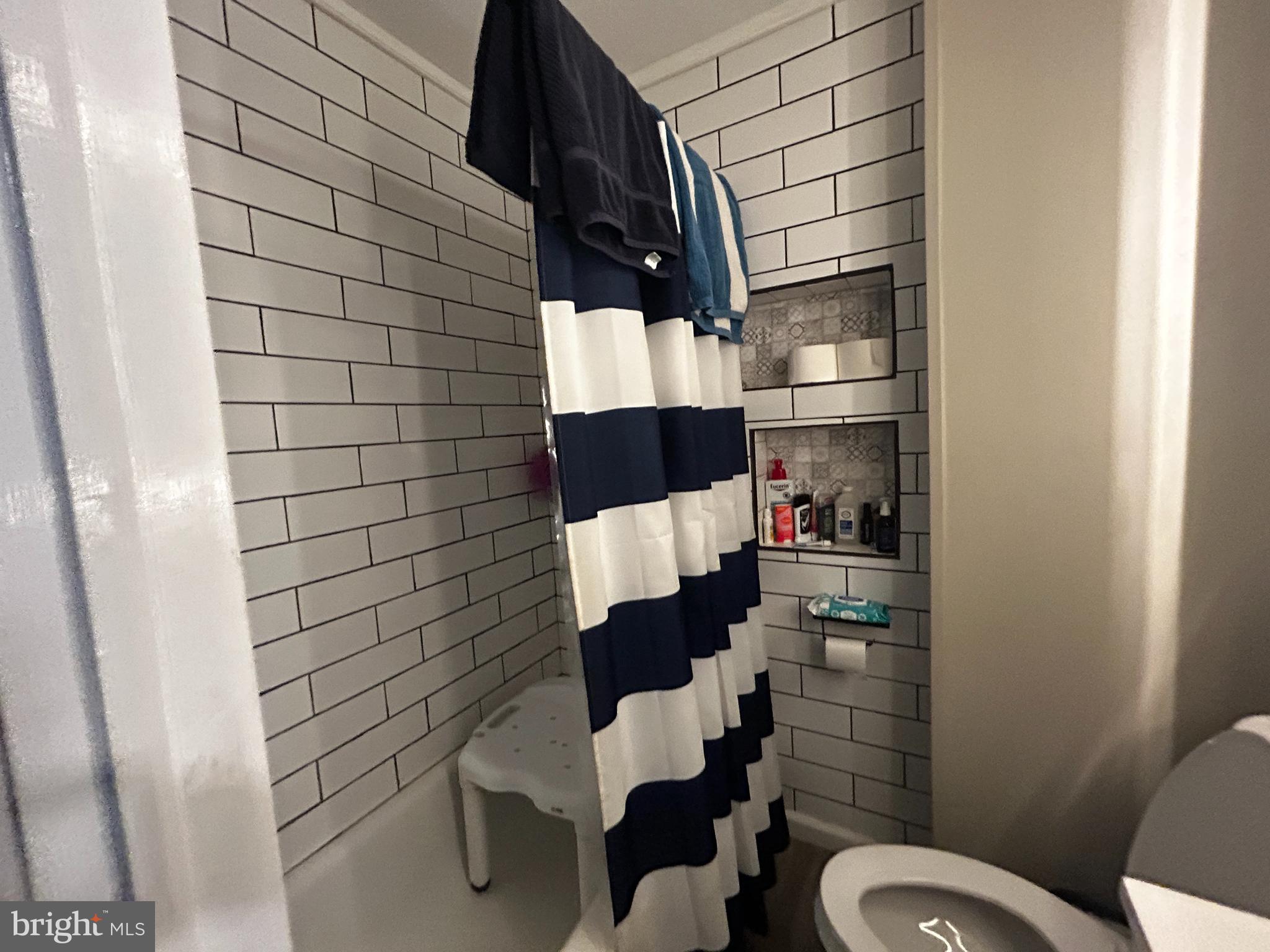 1117 Rosalie Street, Unit 1 Philadelphia, PA 19149 - Photo 11 of 29 a bathroom with a toilet and a shower