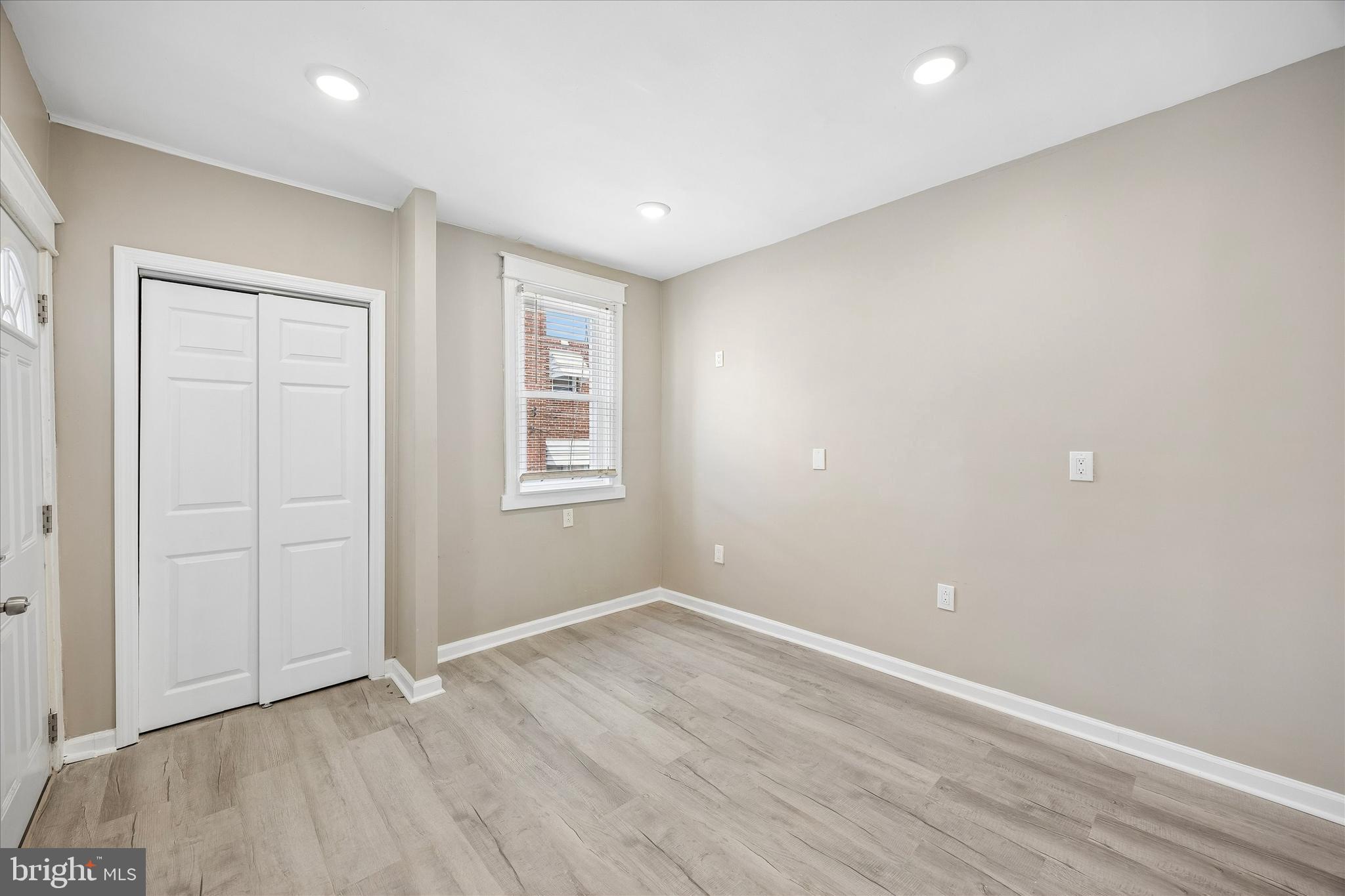 1117 Rosalie Street, Unit 1 Philadelphia, PA 19149 - Photo 17 of 30 an empty room with wooden floor and windows