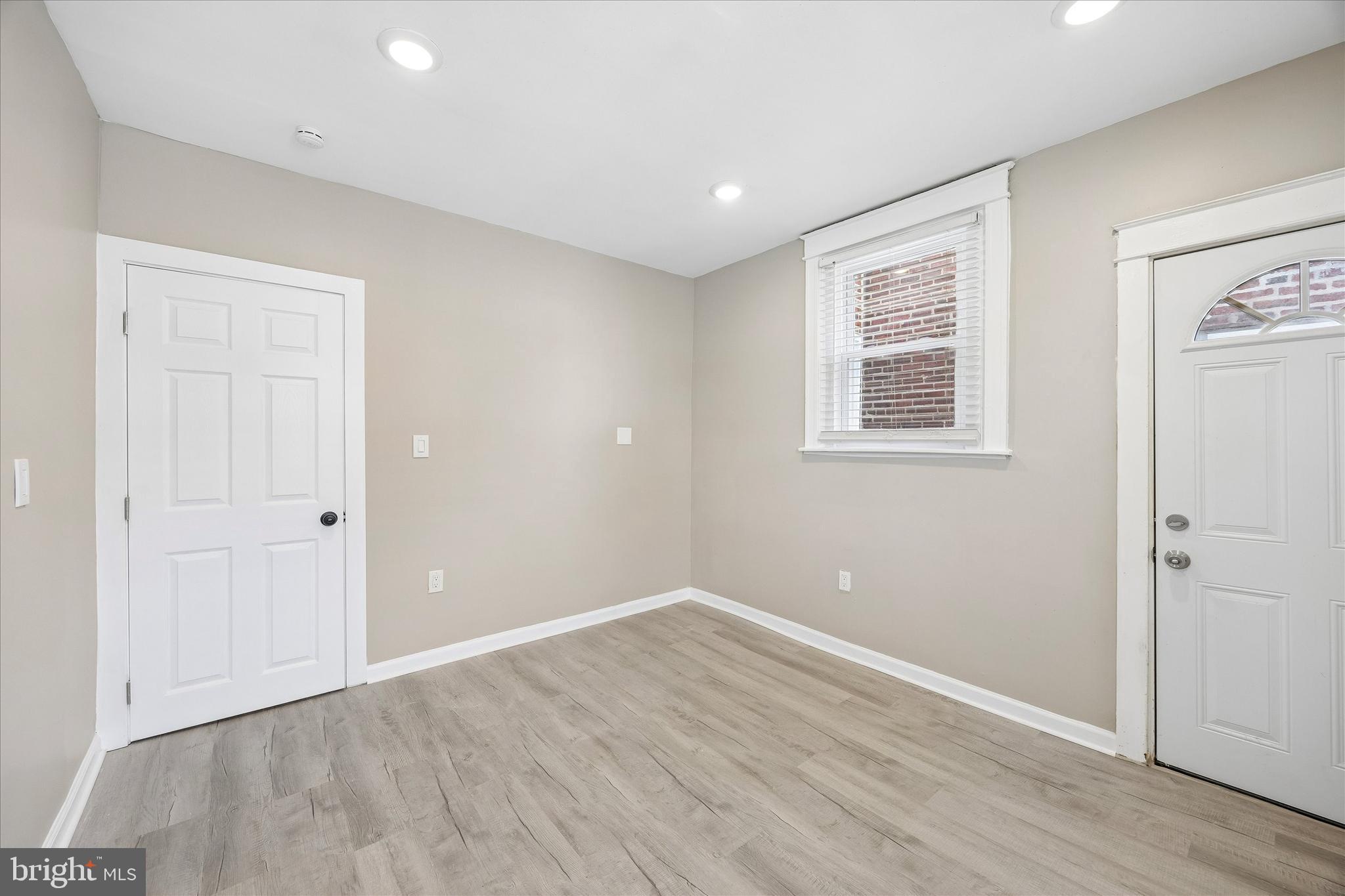 1117 Rosalie Street, Unit 1 Philadelphia, PA 19149 - Photo 18 of 30 wooden floor in an empty room with a window