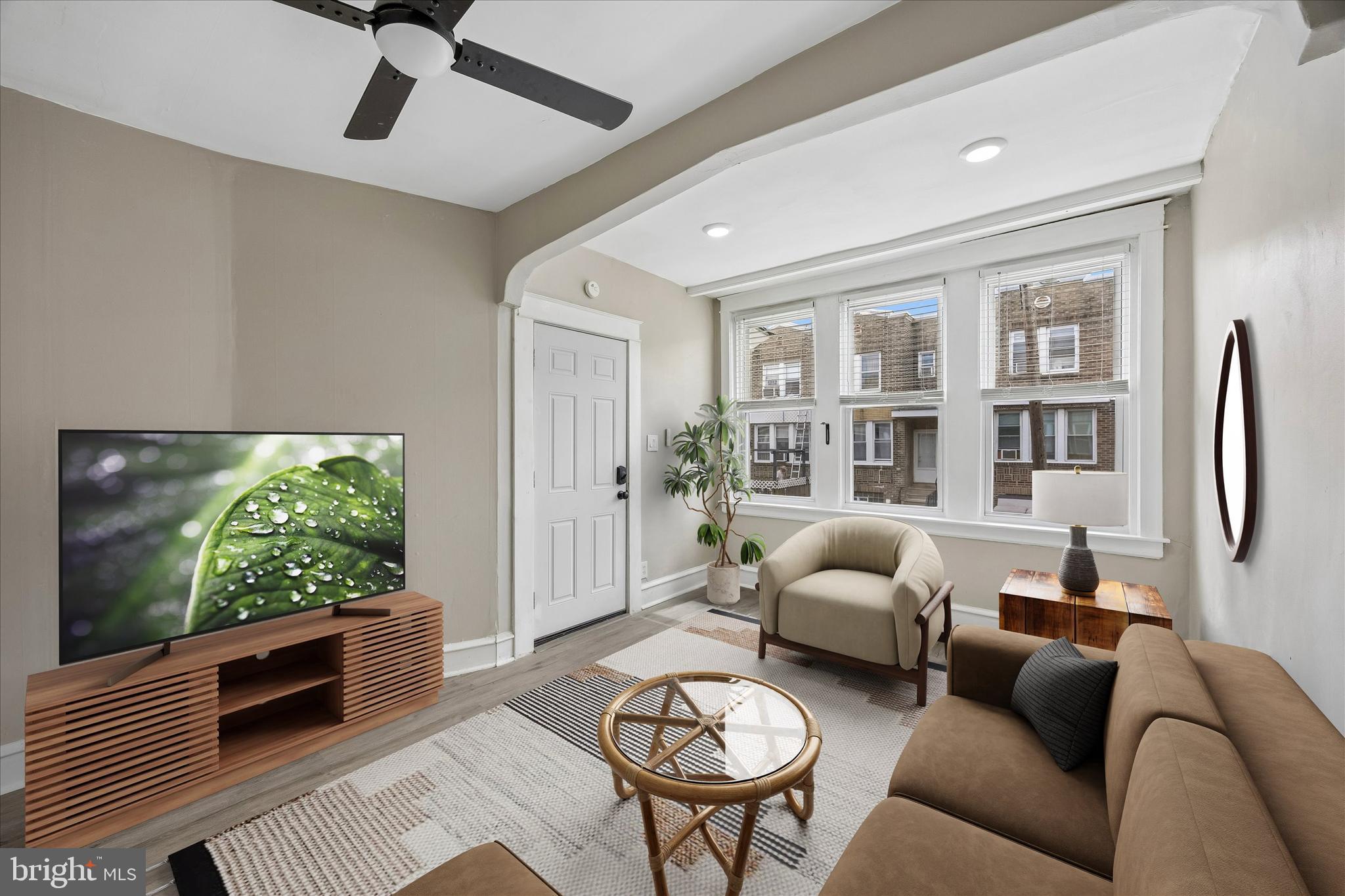 1117 Rosalie Street, Unit 1 Philadelphia, PA 19149 - Photo 2 of 30 a living room with furniture and a flat screen tv