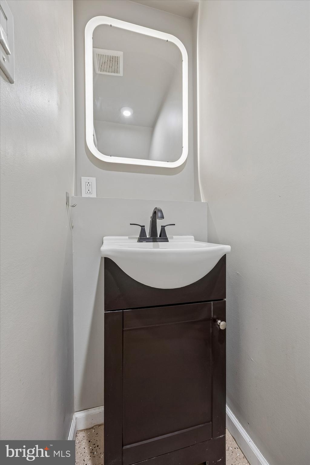 1117 Rosalie Street, Unit 1 Philadelphia, PA 19149 - Photo 21 of 30 a bathroom with a sink and a mirror