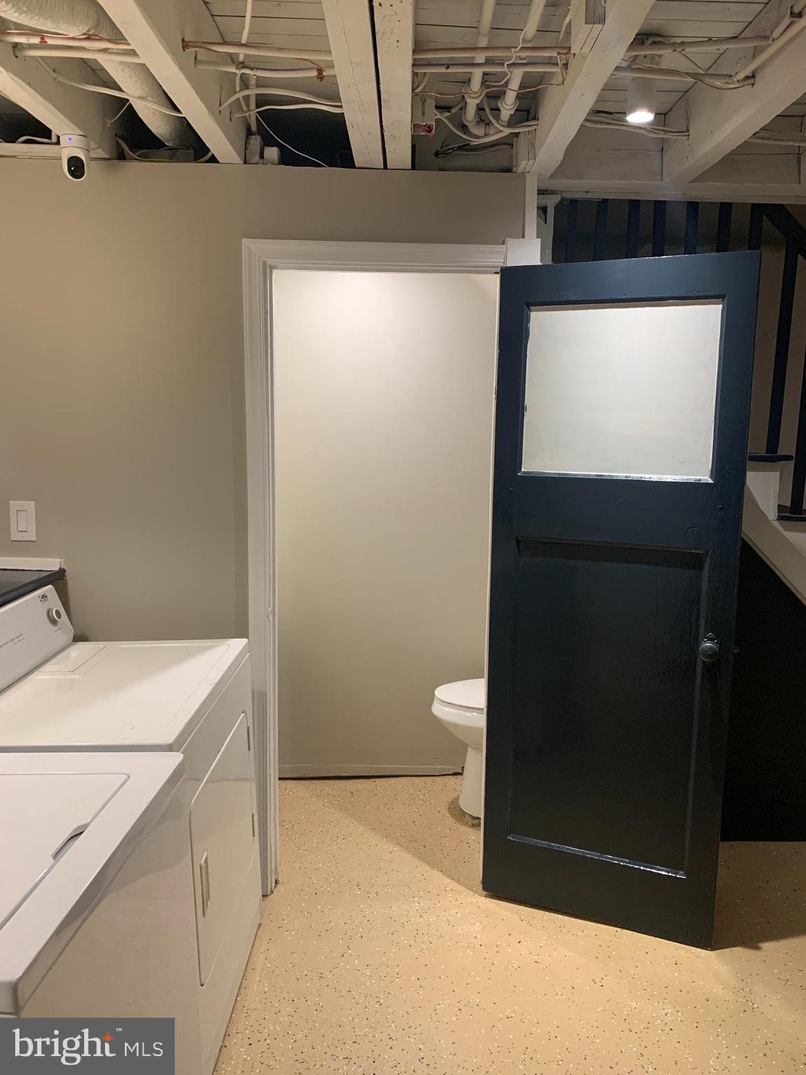 1117 Rosalie Street, Unit 1 Philadelphia, PA 19149 - Photo 21 of 29 a bathroom with a sink a toilet and a mirror