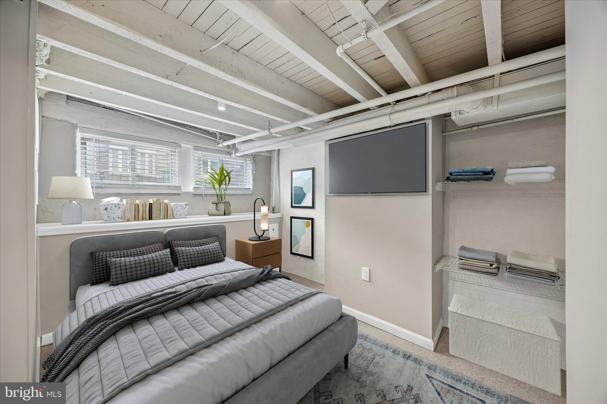 1117 Rosalie Street, Unit 1 Philadelphia, PA 19149 - Photo 23 of 30 a bedroom with a bed couch and a window