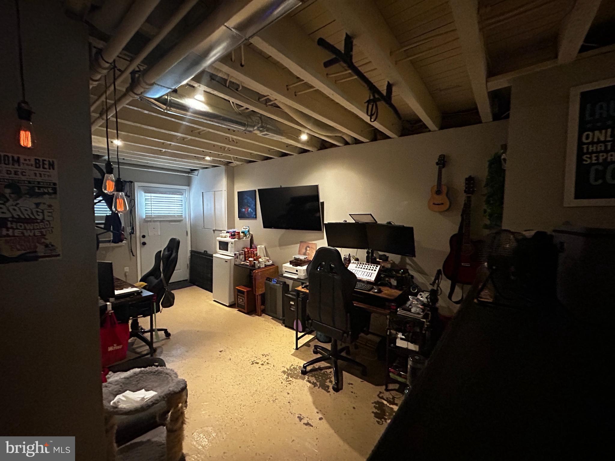 1117 Rosalie Street, Unit 1 Philadelphia, PA 19149 - Photo 24 of 29 a room with gym equipment and a flat screen tv