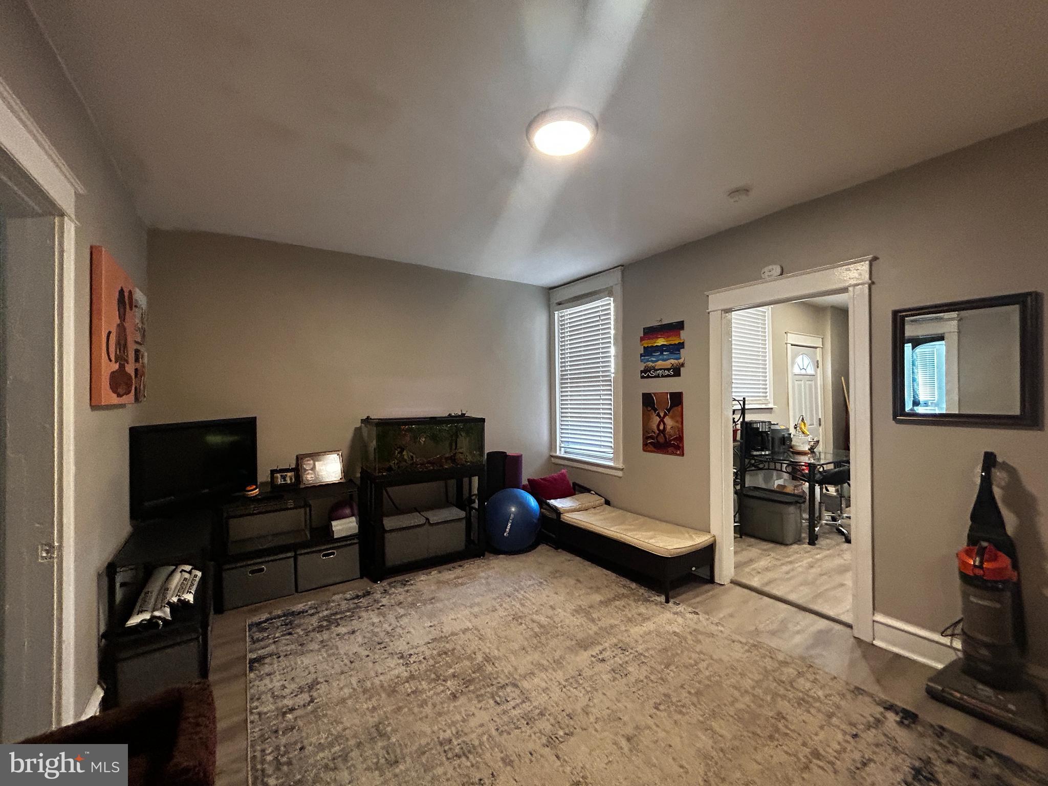 1117 Rosalie Street, Unit 1 Philadelphia, PA 19149 - Photo 5 of 29 a bedroom with furniture and a window