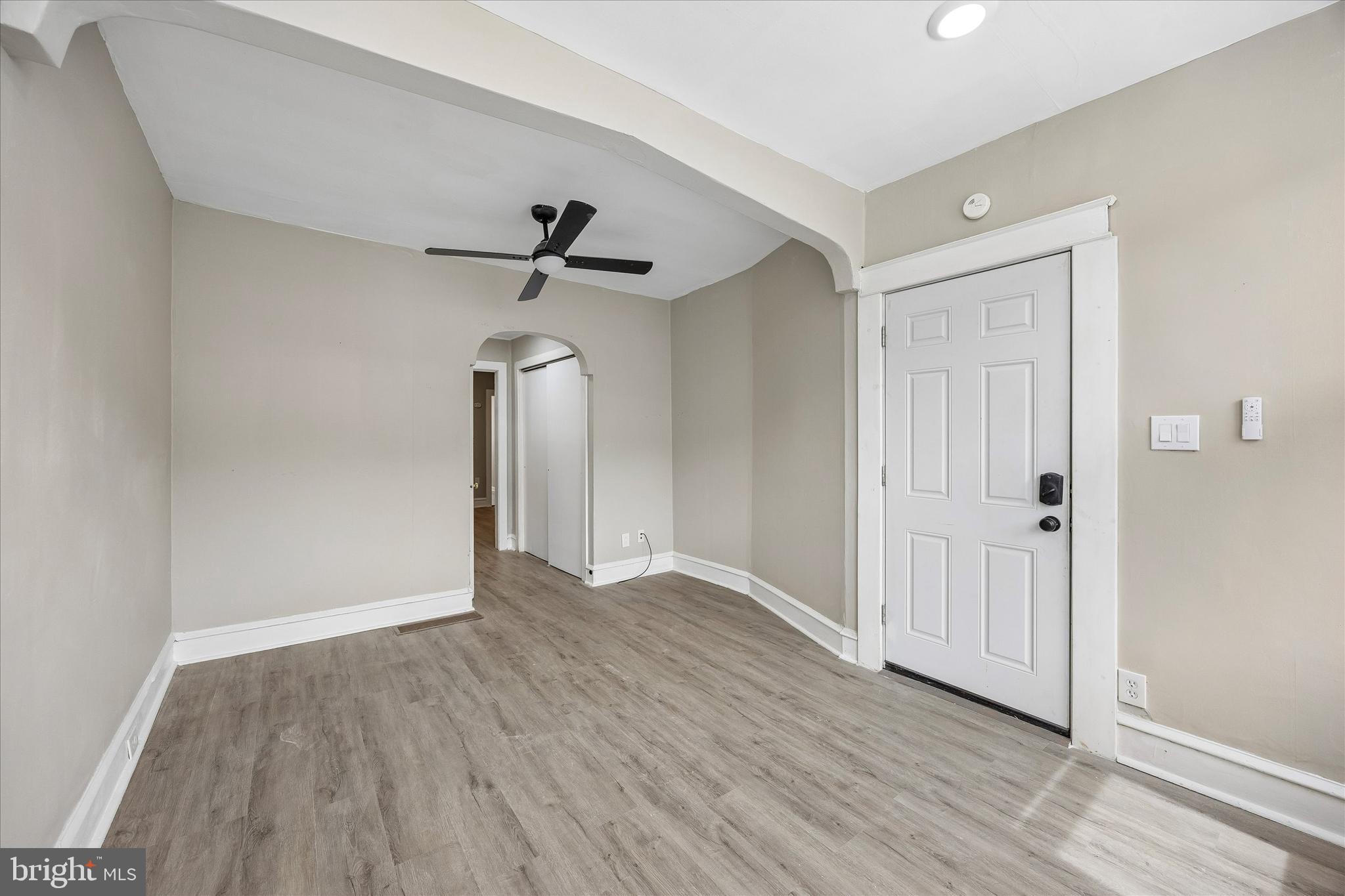 1117 Rosalie Street, Unit 1 Philadelphia, PA 19149 - Photo 6 of 30 a view of empty room with wooden floor and ceiling fan