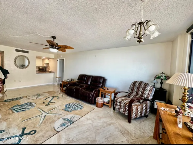 a bedroom with furniture and a chandelier